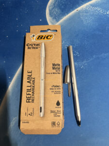 The BIC Refillable Pen package with the pen uncapped next to it