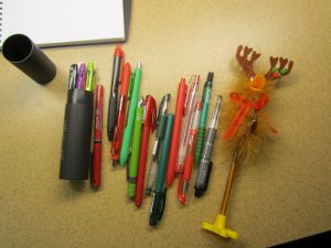 A pile of assorted pens.