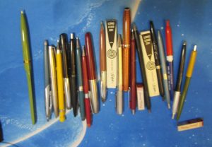 A large group of vintage ballpoint pens, fountain pens, and mechanical pencils