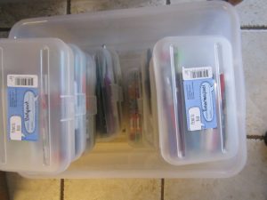Pencil boxes full of pens and pencils