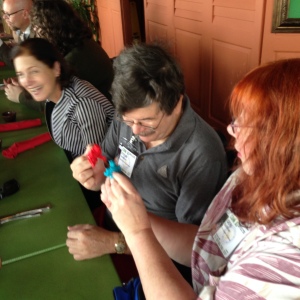 Steve Jackson and Geri Sullivan with ROCK 'EM SOCK 'EM ROBOT puppets. 
