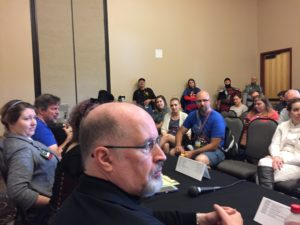 A photo of a Star Wars talk with audience and Timothy Zahn